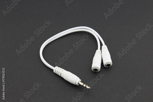 Earphones splitter cable, black background photo