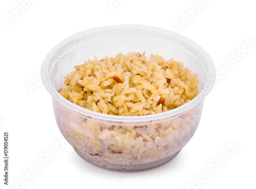brown rice in plastic cup isolated on white background