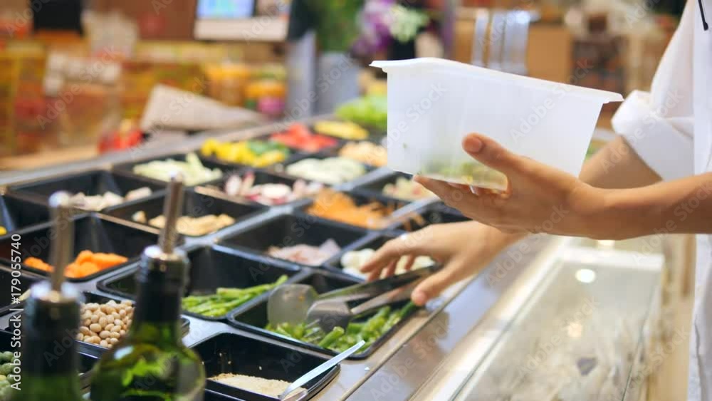 Young Caucasian Woman Buying Organic Vegetables in Salad Bar at Food Store. Vegetarian Take Away Food Fitness Diet Healthy Lifestyle Concept. 4K. Young Caucasian Woman Buying Organic Vegetables in Salad Bar at Food Store. Vegetarian Take Away Food Fitness Diet Healthy Lifestyle Concept. 4K.