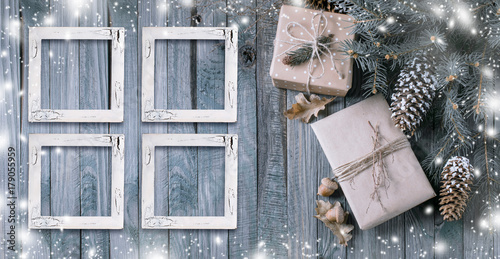 Christmas background with gift box and frames on wooden planks