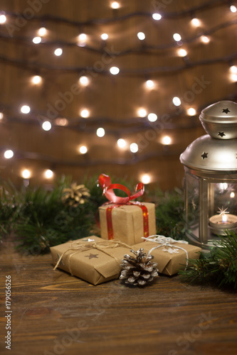 Burning lantern and christmas decoration on white background
