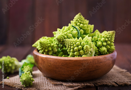 Cabbage romanesco on a dark wooden background