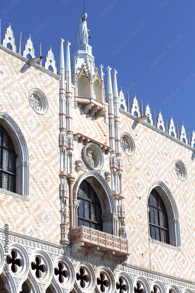 Doge's Palace on Piazza San Marco, Goddess of Justice statue at the top, Venice, Italy.