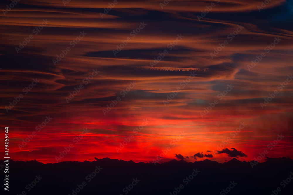 lenticular clouds at sunset over italian Alps - Lombardy Italy
