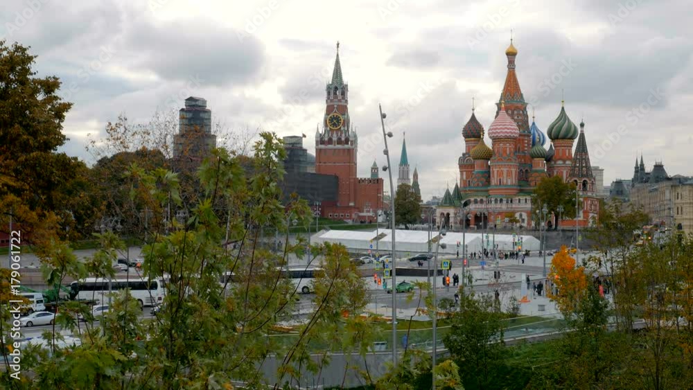 view on Red Square and St Basils Cathedral through leaves of trees and branches view on Red Square and St Basils Cathedral through leaves of trees and branches