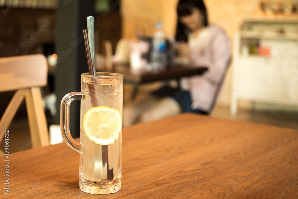Health care fresh lemon juice drink with ice on wooden table