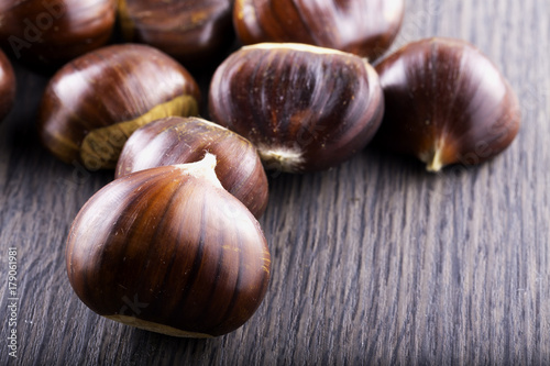 Chestnuts over wooden table