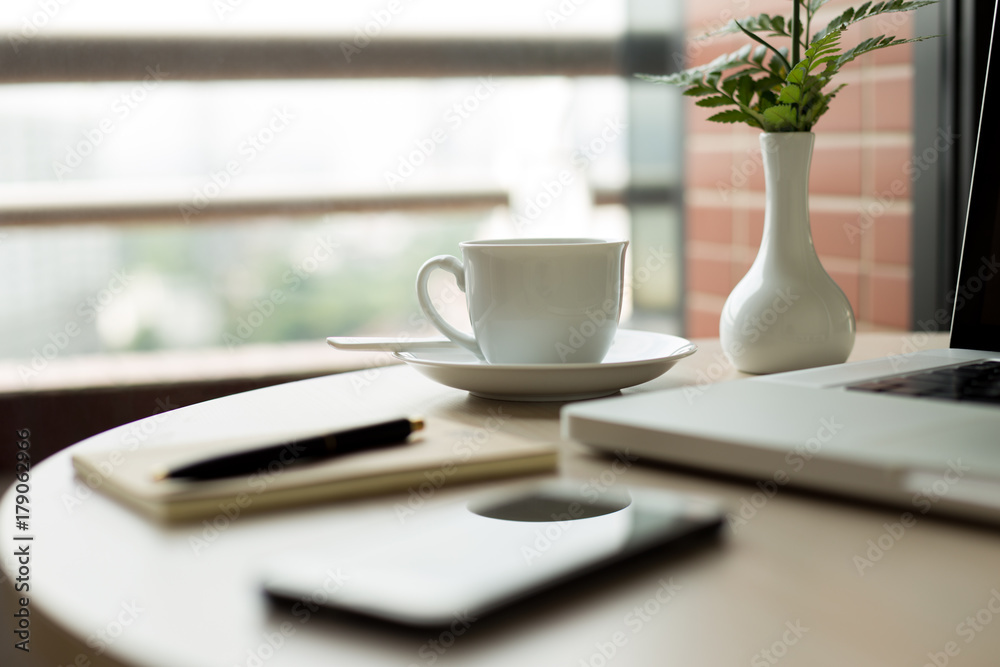 Selected focus cup of coffee and laptop with pen Selected focus cup of coffee and laptop with pen