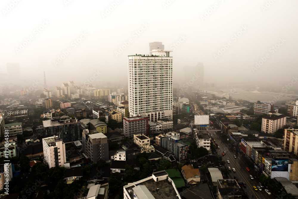Fototapeta premium Heavy rain and stoom over tall building bangkok city