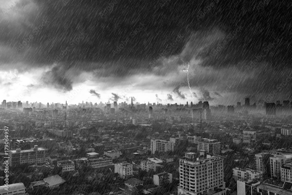 Storm clouds with heavy rain and lightning over city in Bangkok Thailand