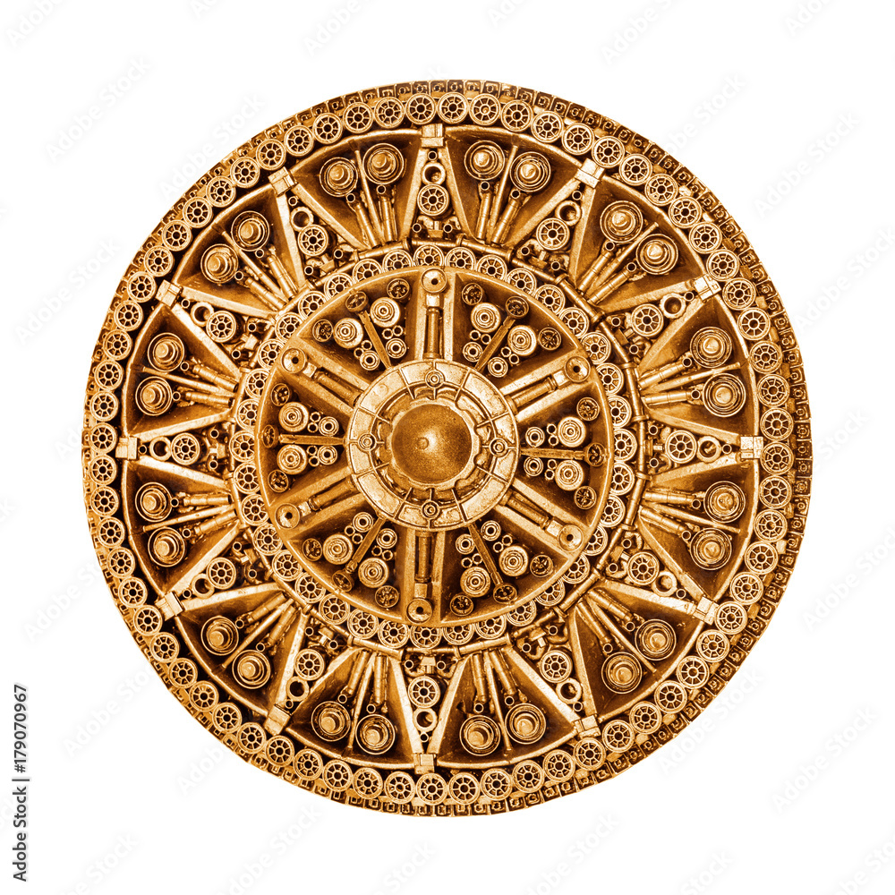Round golden decorative element of metal parts on a white background. Isolated