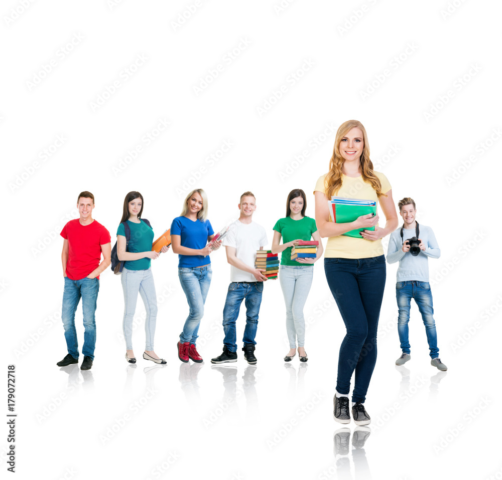 Obraz premium Large group of teenage students isolated on white background. Many different people standing together. School, education, college, university concept.