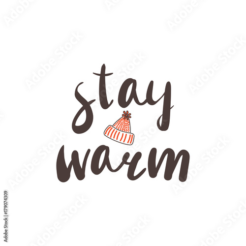 Hand drawn vector illustration with a quote Stay warm and knitted hat with a pompom. Isolated objects on white background. Design concept winter, autumn, children.