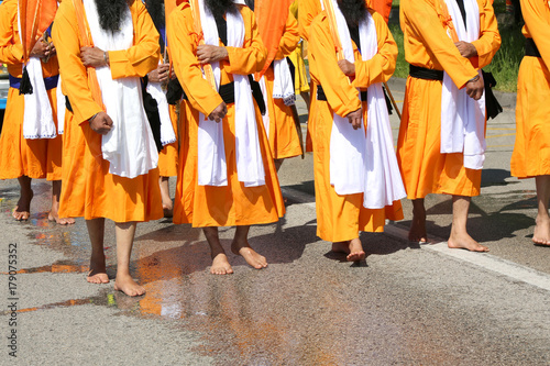 people with orange dresses during the religious Sikh event