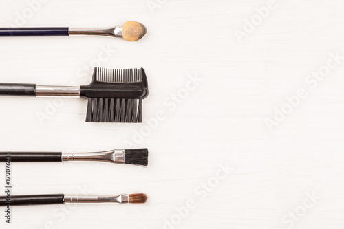 Items for make up on a white background, top view, copy space