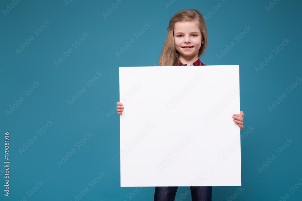 Pretty girl in shirt with long hair hold the white paper Pretty girl in shirt with long hair hold the white paper