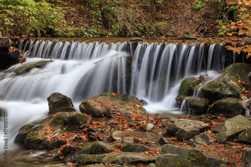 Beautiful streams and small waterfalls near the big Carpathian waterfall Shypit. In the autumn.