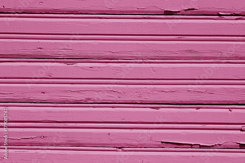Pink grungy wooden wall pattern.