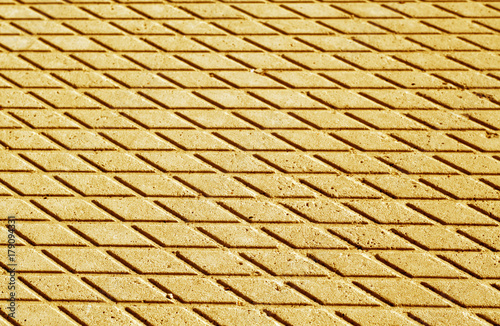 Orange color cement floor pattern with blur effect.