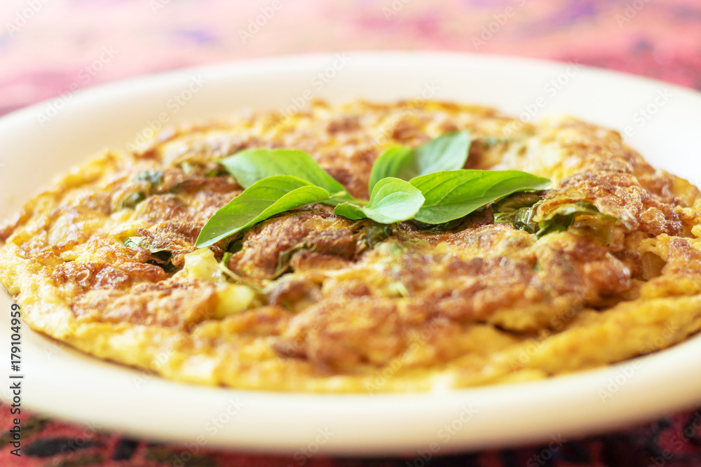 Close-up of omelet with vegetables and herb Close-up of omelet with vegetables and herb