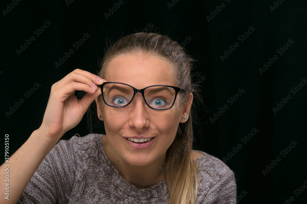 portrait of a beautiful girl on a black background. portrait of a beautiful girl on a black background.