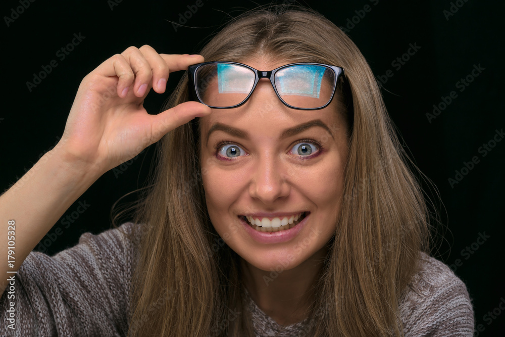 portrait of a beautiful girl on a black background. portrait of a beautiful girl on a black background.