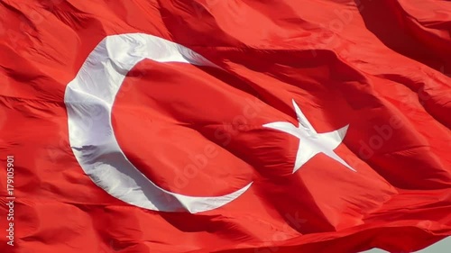 SM Close Up Turkish Flag fluttering in the breeze. Slow Motion and slightly zoom out HD video. The flag of Turkey; A red flag featuring a white star and crescent often called as moon-star (Ayyildiz) photo