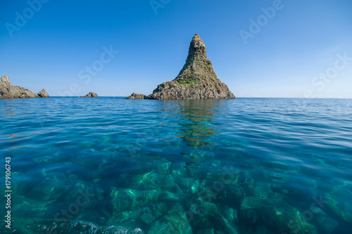 "Faraglioni" the famous cyclops island in Acitrezza, Sicily