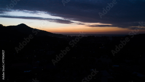 Aerial drone view of beautiful sunset sky above tropical island