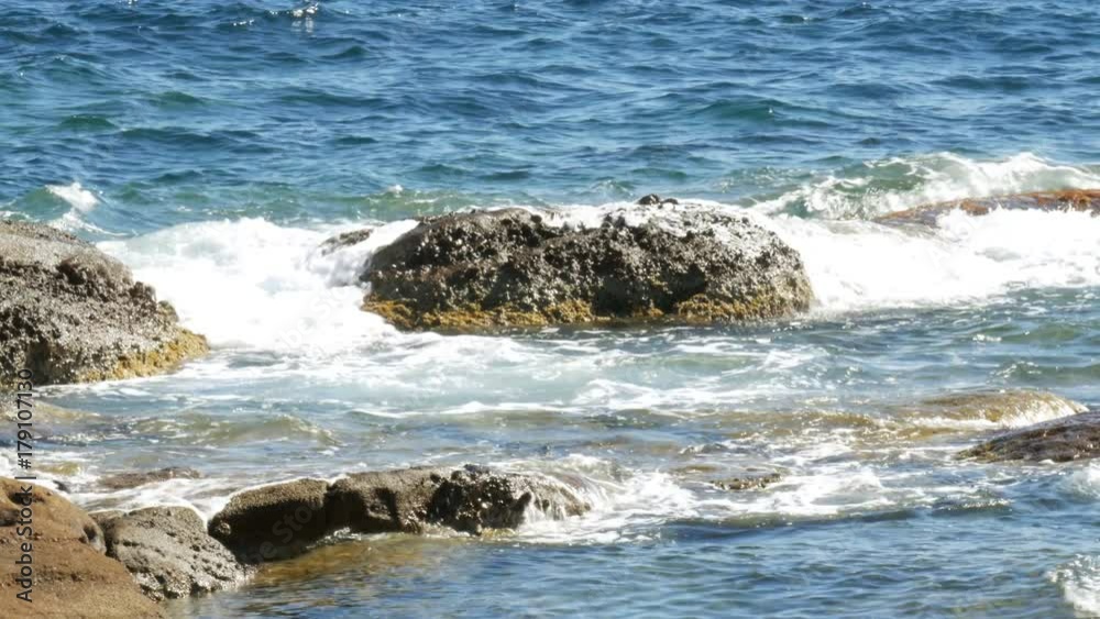 Peaceful waves splashing on stony beach - 4k Peaceful waves splashing on stony beach - 4k