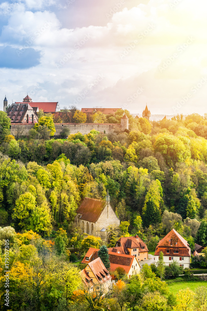 Europe culture concept - panoramic city skyline birds eye aerial view under dramatic sun and morning blue cloudy sky in Rothenburg, Germany