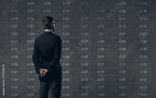Billede på lærred Businessman standing over diagram background