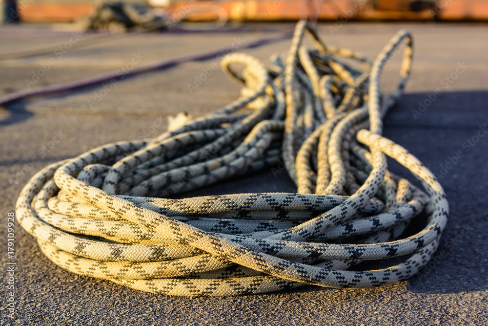 Close up braided climbing rope on asphalt