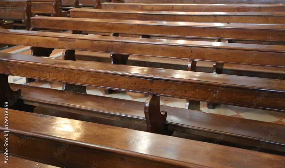 wooden benches inside a church wooden benches inside a church