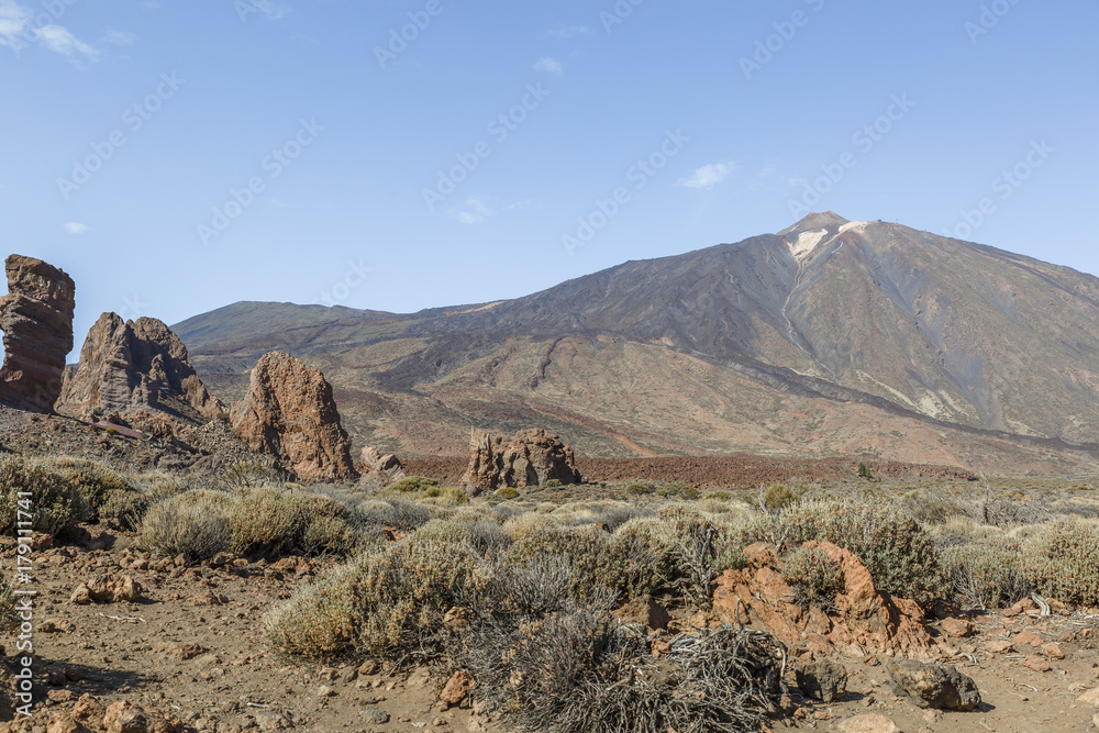 View of the volcano Teide and a group of volcanic rocks in the Teide National Park, Canary Islands, Spain