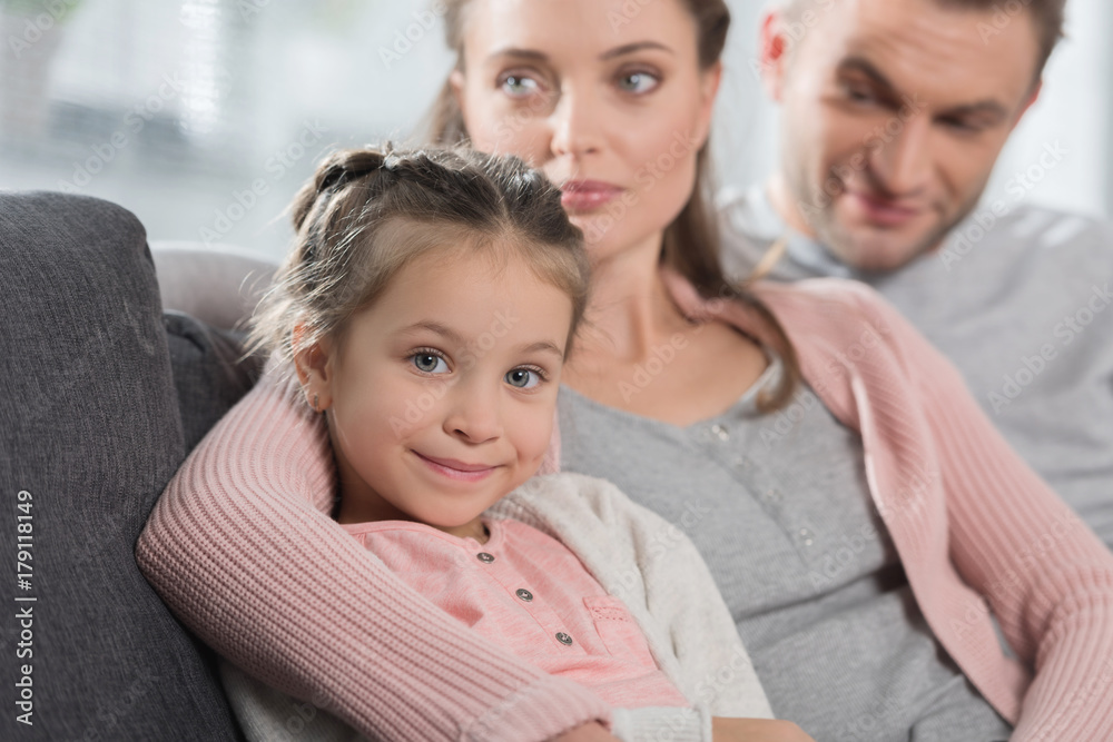 Family sitting on couch