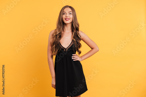 Portrait of a pretty seductive girl in black dress
