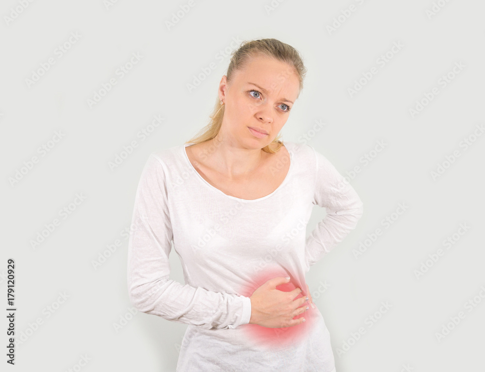 The young girl blondes stomach ache. mockup. Isolated on a white background. The young girl blondes stomach ache. mockup. Isolated on a white background.