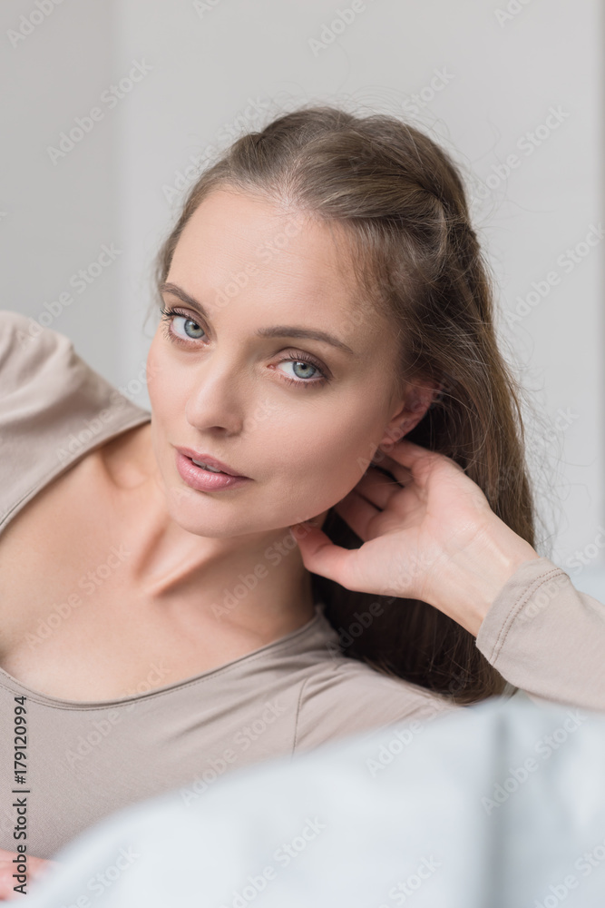 woman lying on bed woman lying on bed
