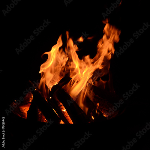 Flames from a frie on a dark background.