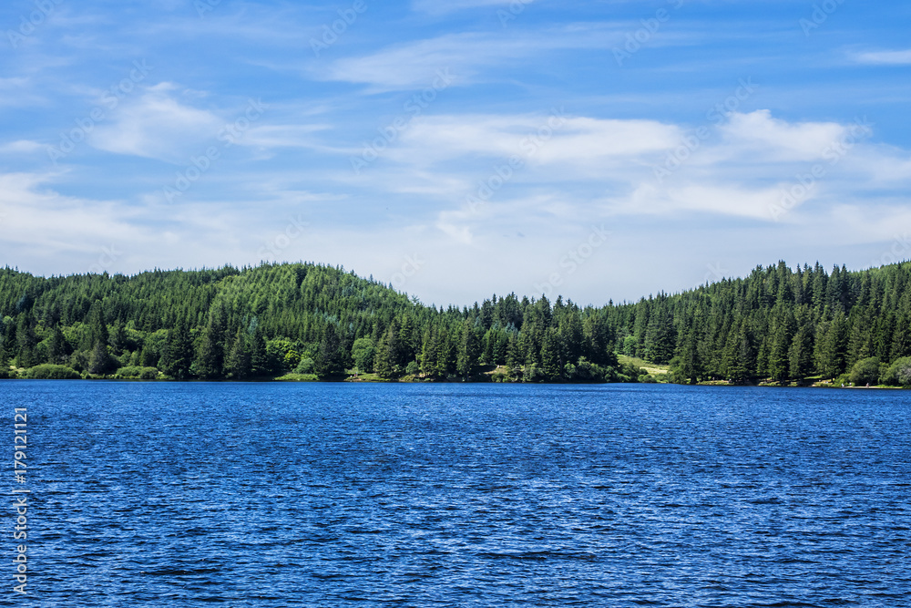 View of Lake Guery. Lake Guery is a mountain lake of volcanic origin located in Monts Dore, in the heart of the Massif Central. It is the highest of the Auvergne lakes. Auvergne-Rhone-Alpes. France.