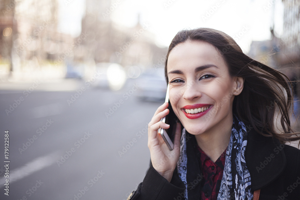 happy beautiful woman talking on smartphone in the big city happy beautiful woman talking on smartphone in the big city