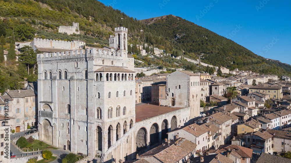 Gubbio, Italy. One of the most beautiful small town in Italy. Drone aerial view of the city center, main square and the historical building called Palazzo dei Consoli