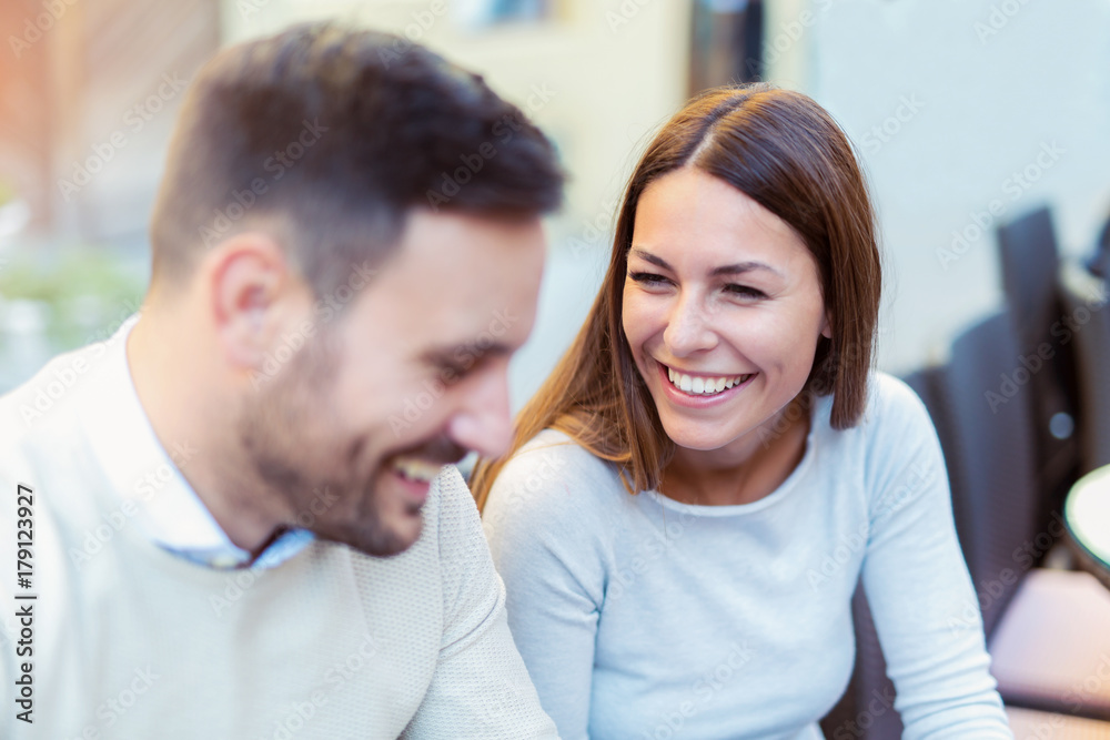 Young couple in love talking in restaurant outdoor, Young couple in love talking in restaurant outdoor,