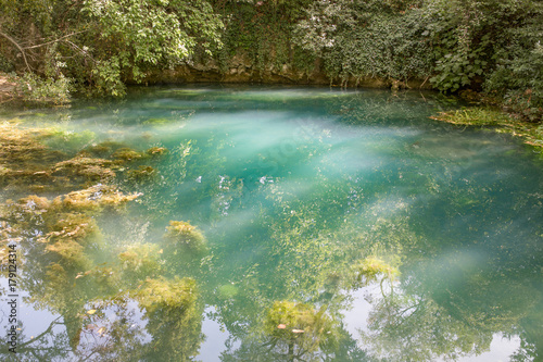 Resurgence of the Timavo river by a church in San Giovanni di Duino, or San Giovanni in Tuba. Karst river, Fruglia, Triest region, Italy. photo