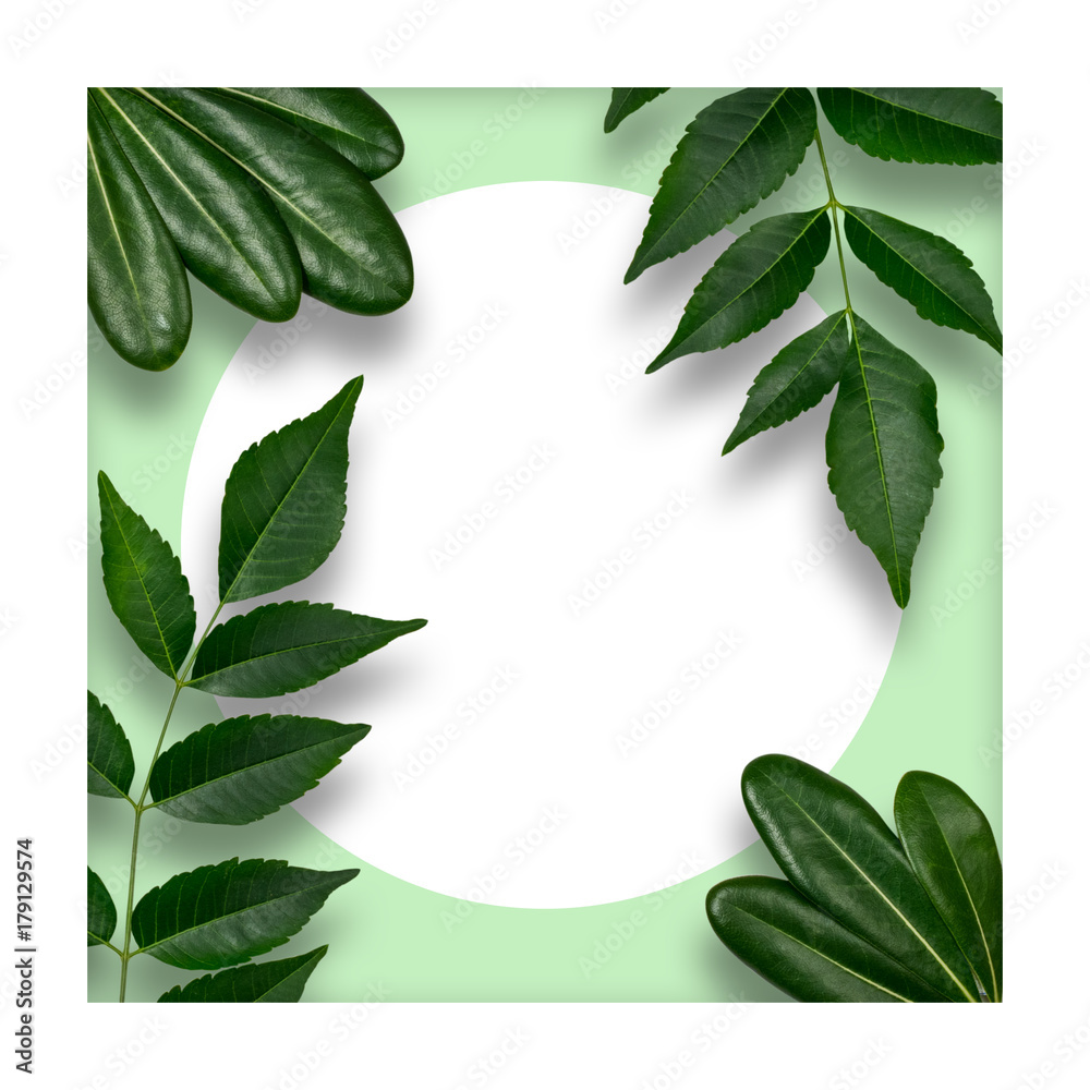 Naklejka premium Creative layout made of flowers and leaves with paper card note. Flat lay. Nature concept