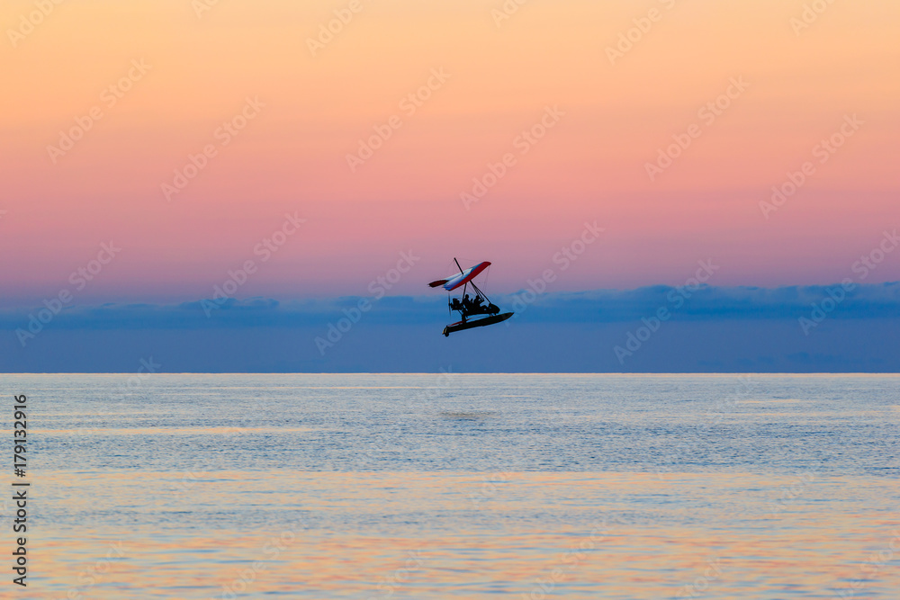 Fototapeta premium Flying airplane over the Black sea