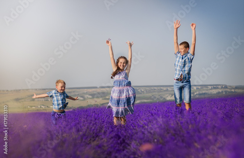 children jumping in lavender