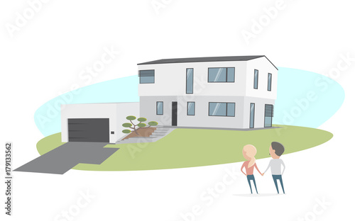 couple standing in front of a modern house