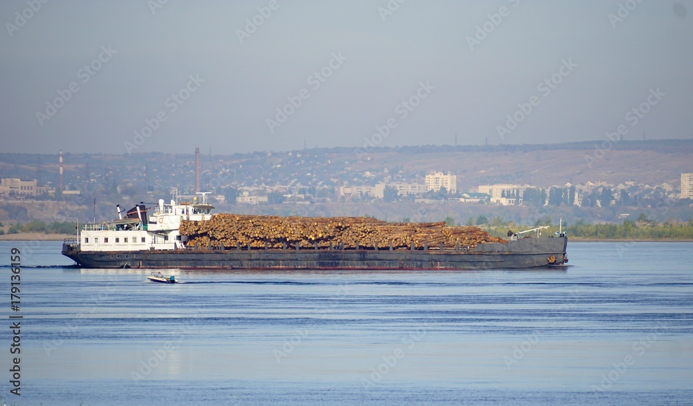 Transportation of timber along the Volga River by boat